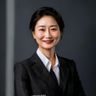 人妻猎人创始人李维的专业形象照，身着简洁商务装，面带自信微笑，展现出资深内容行业从业者的专业气质